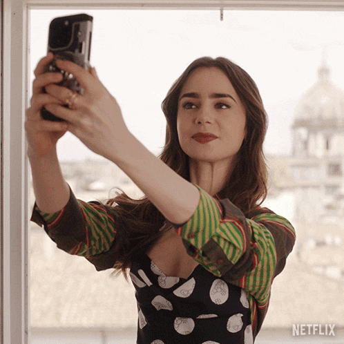 Gif - Emily Cooper taking a selfie